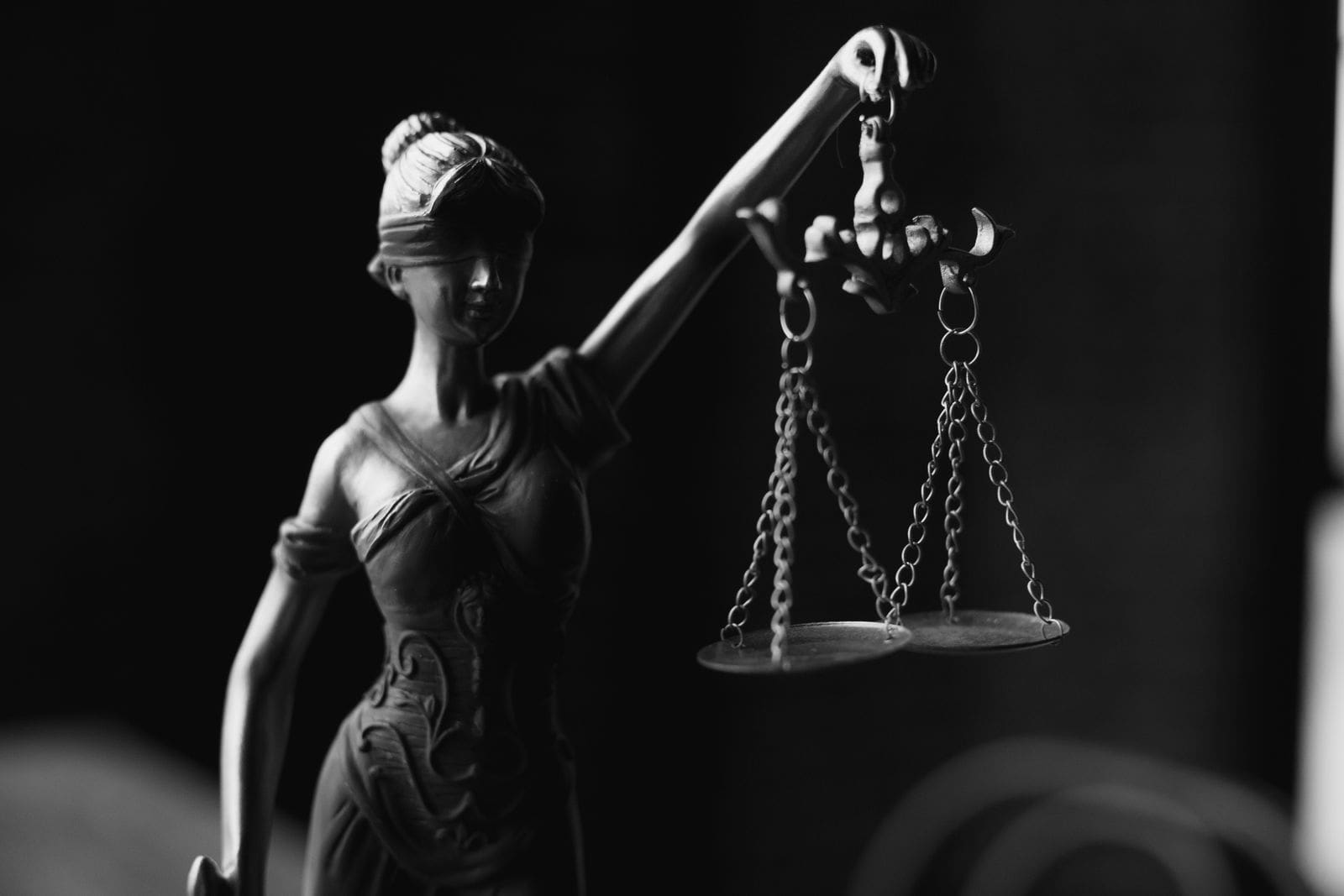 A statue of Lady Justice holding the scales of justice