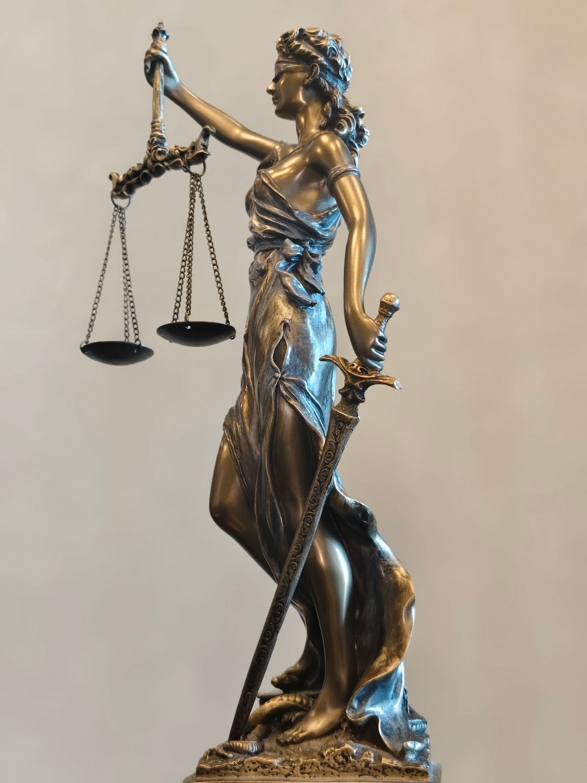 A statue of Lady Justice holding the scales of justice