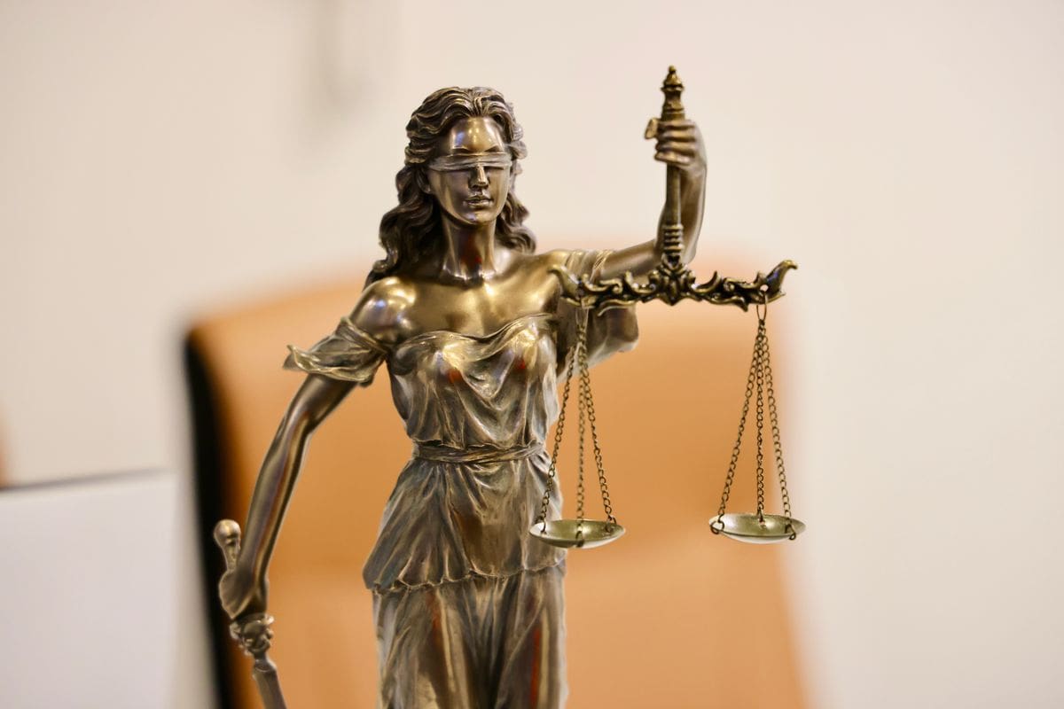 A statue of Lady Justice holding the scales of justice